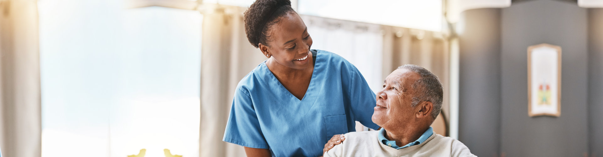 image of the ederly man and the home care staff